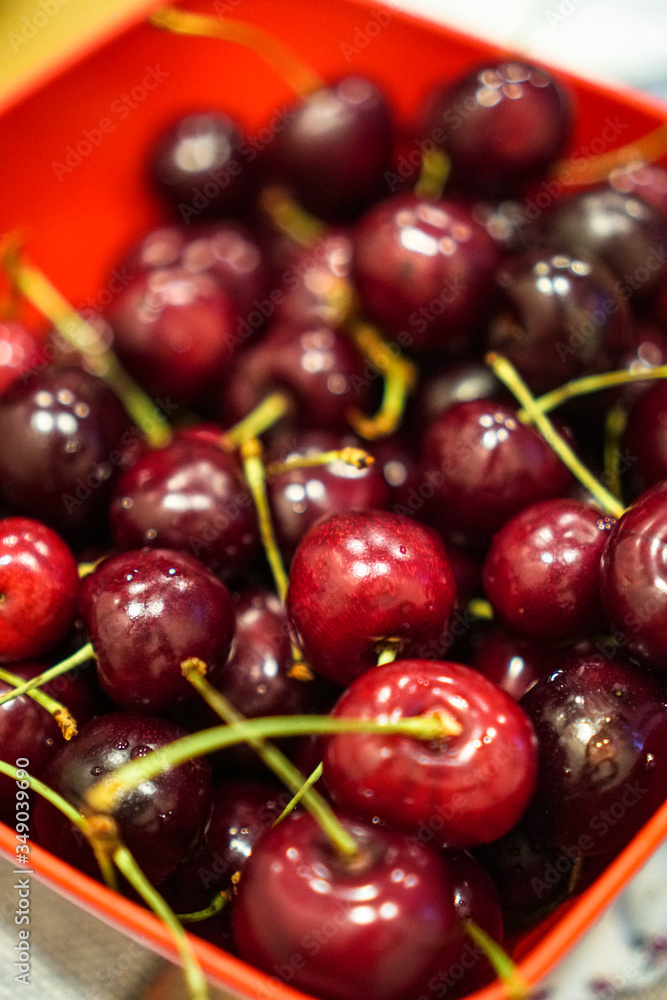 Lot of ripe red and juicy cherries. Cherry for the whole frame. Vegetarian breakfast of sour fruits and berries. Stock background Lot of ripe red and juicy cherries. Cherry for the whole frame. Vegetarian breakfast of sour fruits and berries. Stock background