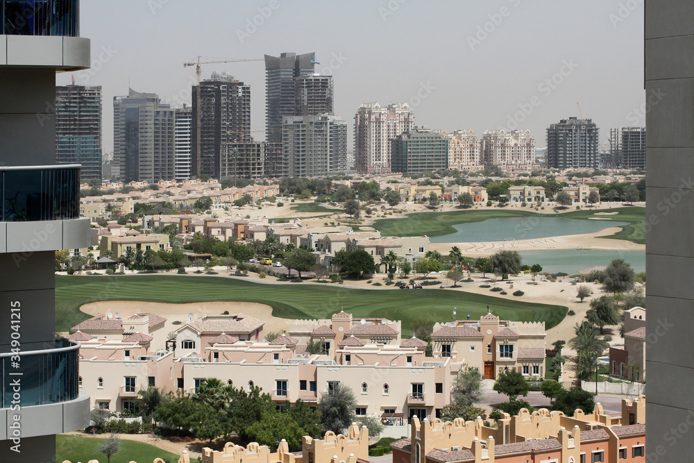 Fototapeta premium The view from the window of a high-rise building on new buildings in Dubai
