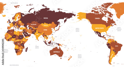 World map - Asia, Australia and Pacific Ocean centered. Brown orange hue colored on dark background. High detailed political map of World with country, ocean and sea names labeling