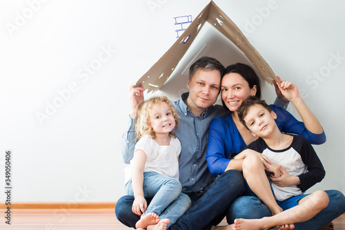 Housing concept of a young modern family. mom dad and children in a new house or apartment