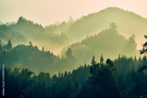 Distant mountains and forests loom.In Sichuan province, China.