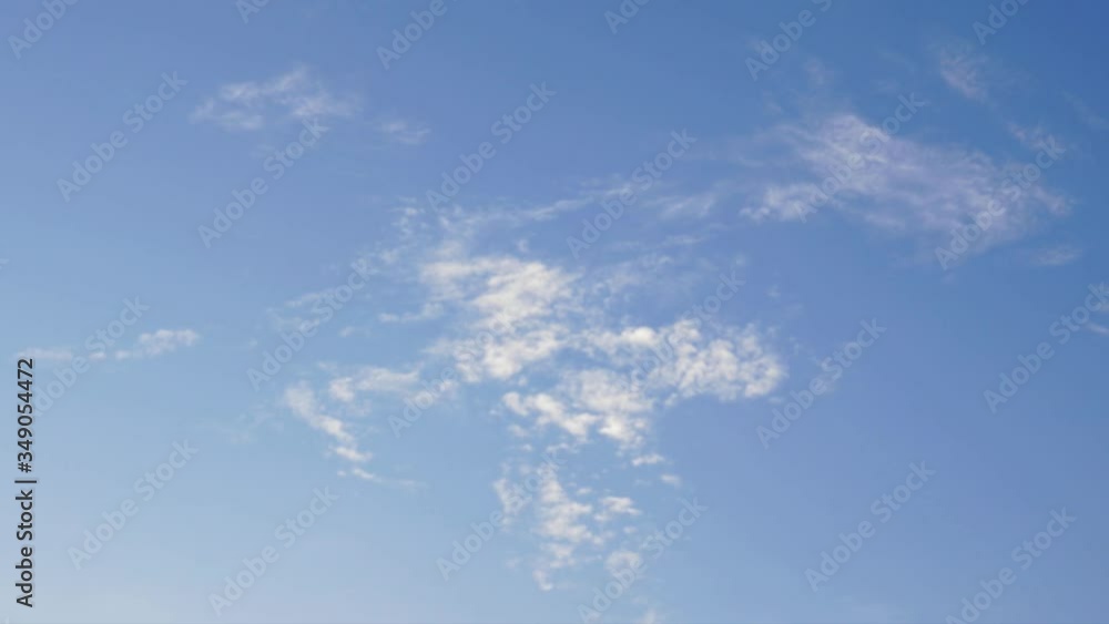 Timelapse of clouds motion on blue sky. Puffy fluffy white clouds moving and dissolve beautifully. Timelapse of clouds motion on blue sky. Puffy fluffy white clouds moving and dissolve beautifully.