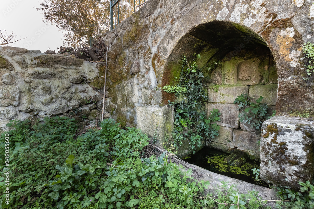 old stone water source in portugal  - ancient well
