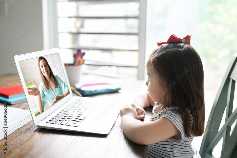 Cute girl learning online with a computer Cute girl learning online with a computer