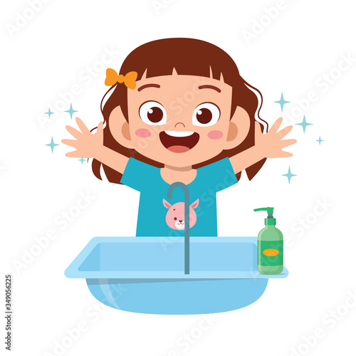 happy cute little kid girl wash hand in sink