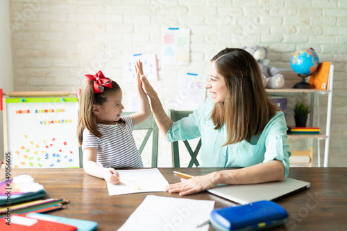 Mom and girl enjoying homeschool together
