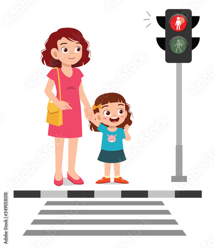 happy cute little kid girl cross the road with mother