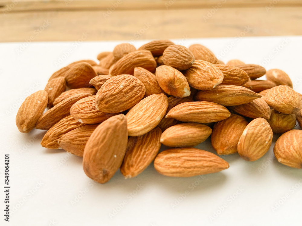 Fototapeta premium almonds on wooden background