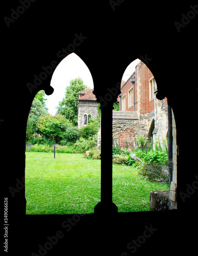 Frame within a frame of arched windows with green grass