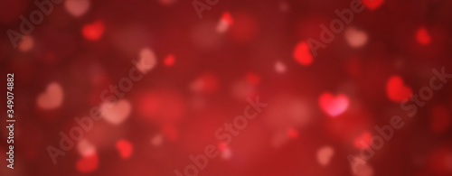 Valentine abstract background with soft bokeh and red hearts