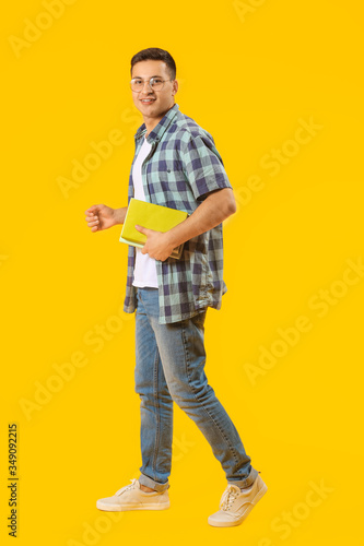 Portrait of male student on color background © Pixel-Shot