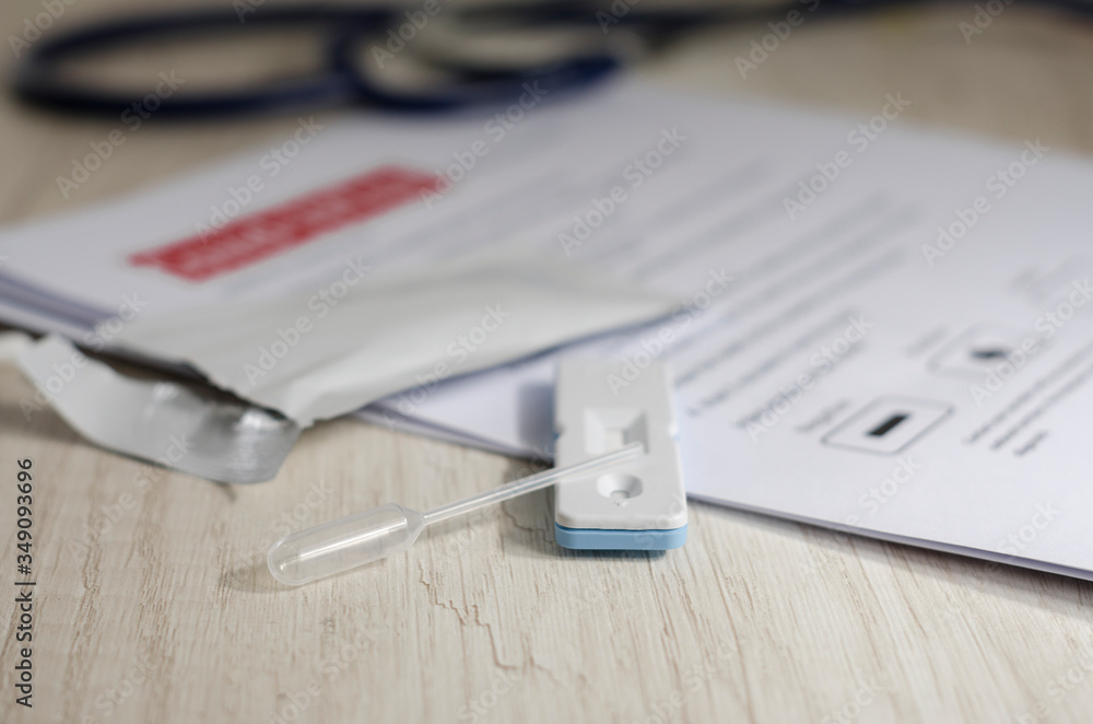 Laboratory scientist performs a rapid diagnostic test (rdt) for antibodies to detect the presence of viral proteins. caused by coronavirus disease COVID-19, PCR laboratory test. Inputs for testing Laboratory scientist performs a rapid diagnostic test (rdt) for antibodies to detect the presence of viral proteins. caused by coronavirus disease COVID-19, PCR laboratory test. Inputs for testing