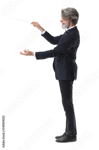 Senior male conductor on white background photo