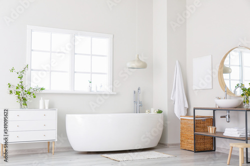 Interior of bathroom with fresh flowers