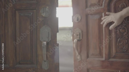 Men's hand open the door home close up. Slog3.