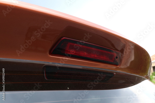 The rear brake light is on the spoiler of the SUV. © the_akg