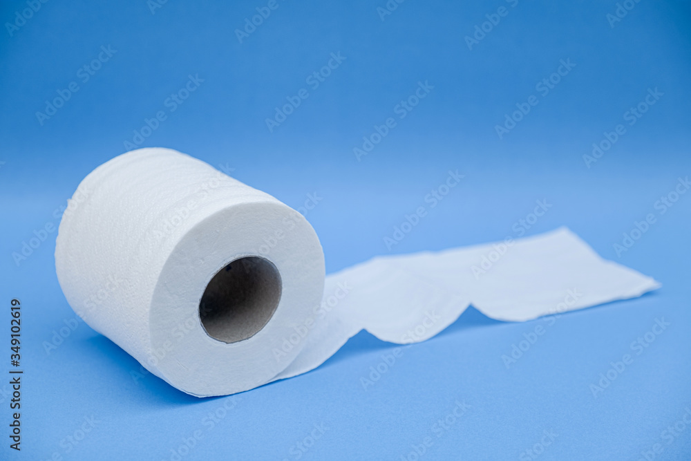 Toilet paper isolated on a blue background Toilet paper isolated on a blue background