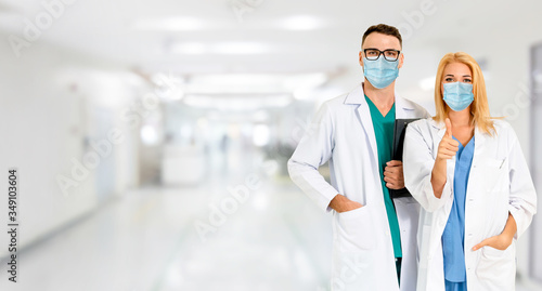 Doctor wear face mask in hospital protect from coronavirus disease or COVID-19. Medical staff are high risk people to receive infection from coronavirus disease or COVID-19. photo