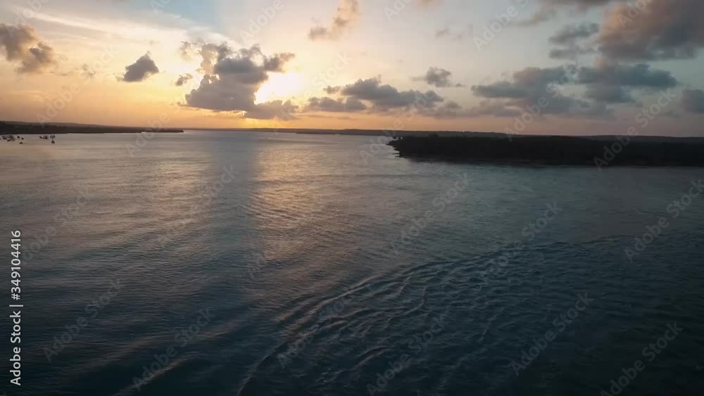 Magical sunset by the sea with green island. Brazil northeast Pipa beach Magical sunset by the sea with green island. Brazil northeast Pipa beach