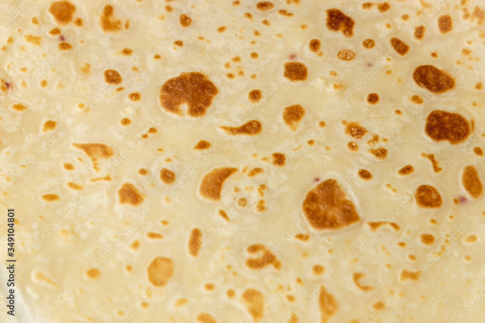 Pancake texture top view. Pancake surface. Abstract background close-up, shallow depth of field, copy space.