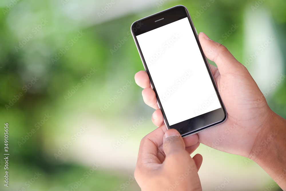 Cropped shot view of man hands holding smart phone with blank copy space screen for your text message or information content, female reading text message on cell telephone during in urban setting. Cropped shot view of man hands holding smart phone with blank copy space screen for your text message or information content, female reading text message on cell telephone during in urban setting.