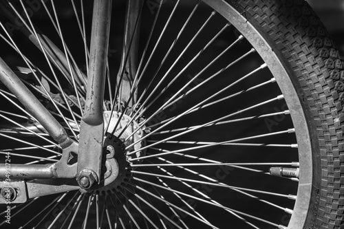 side view old bicycle wheel texture vintage style,whole front black and white memento memory of old time bike photo