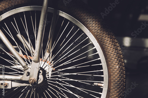 side view old bicycle wheel texture vintage style,whole front black and white memento memory of old time bike photo