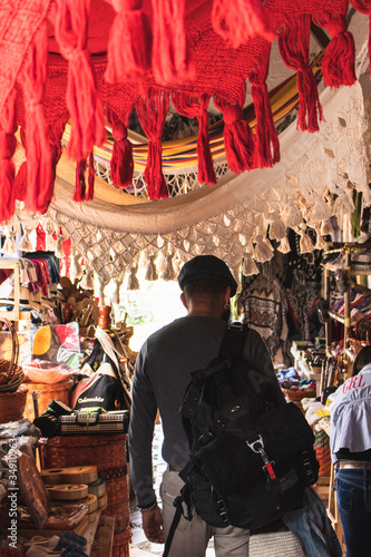 man walking trough handicrafts market