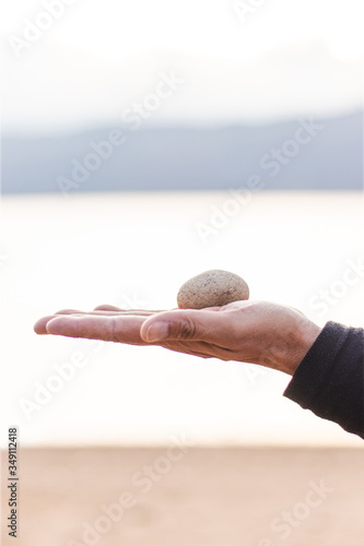 hand holding therapy stone