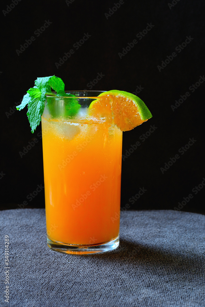 Orange juice on black background. Orange juice on black background.