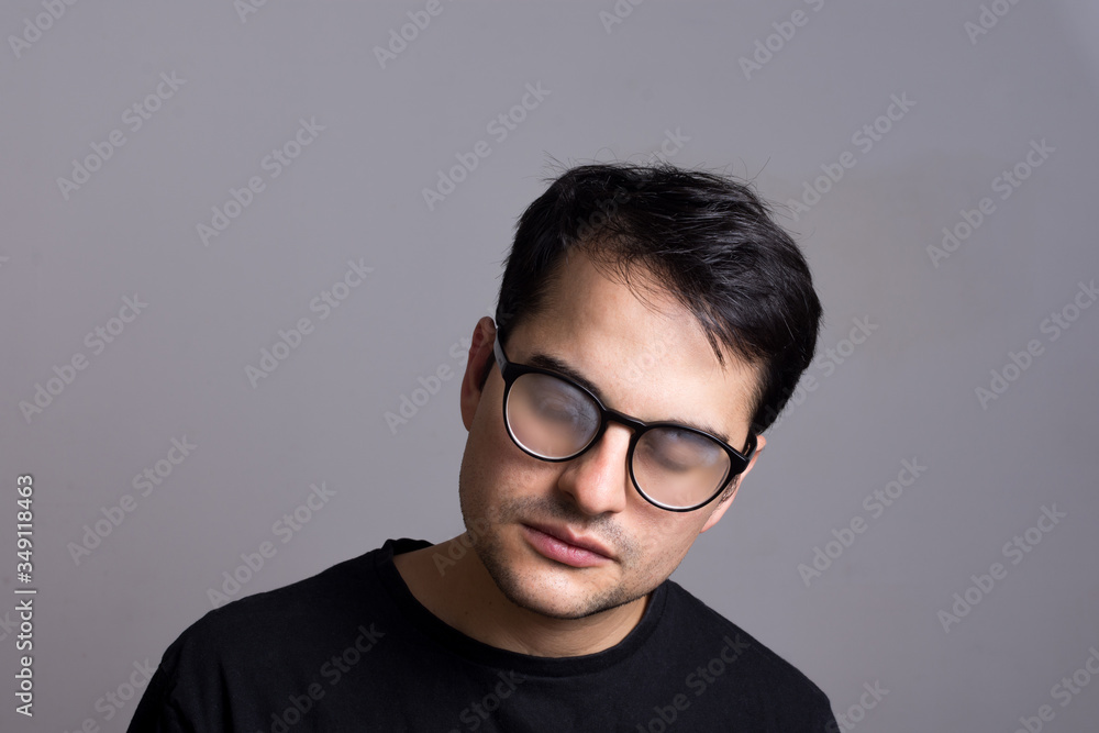 Man with foggy glasses. Hipster man tired with wet glasses. Black outfit. portrait of young man