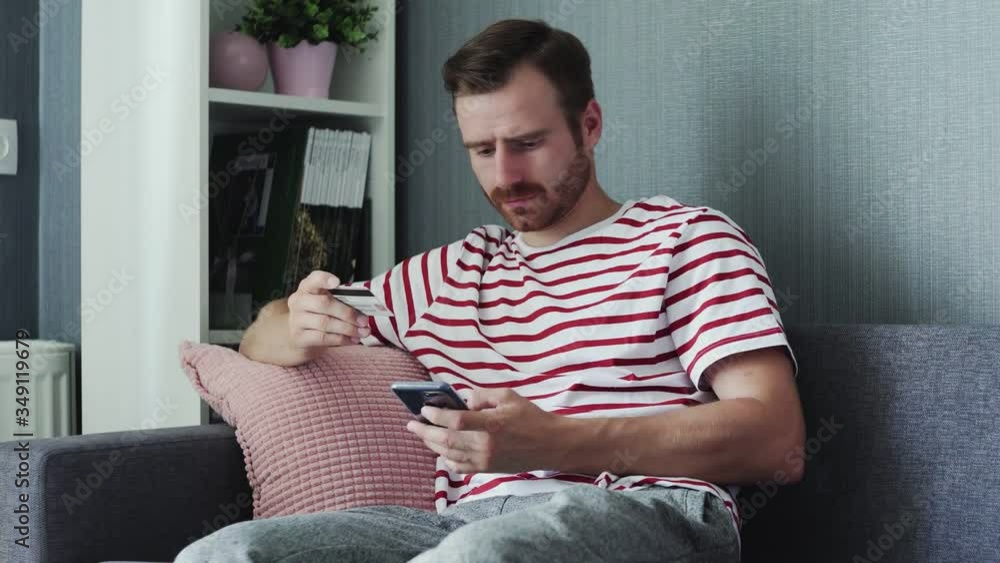 Man using smart phone for online shopping with credit card Man using smart phone for online shopping with credit card