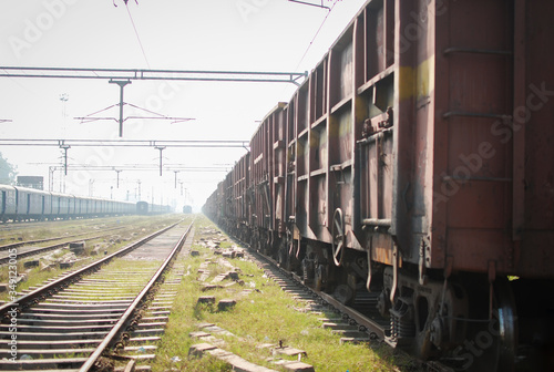 closeup of a red Indian train on track with blur background, Indian Railway 