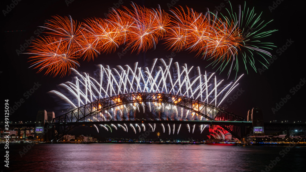 Fototapeta premium NYE 2020 fireworks view from the western side of the Sydney Harbour Bridge. Blues Point Reserve, Sydney, NSW, Australia. 