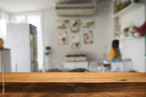 Wood desk space and blurred of kitchen background. for product display montage. business presentation.