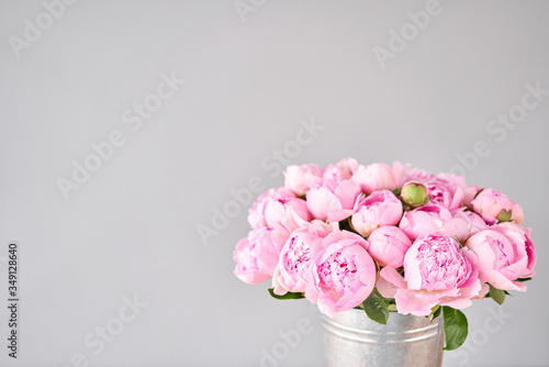 Fototapeta Naklejka Na Ścianę i Meble -  Pink Angel Cheeks peonies in a metal vase. Beautiful peony flower for catalog or online store. Floral shop concept . Beautiful fresh cut bouquet. Flowers delivery