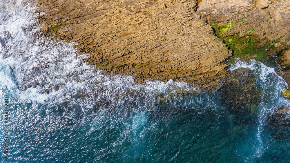 Aerial, landscape of waves of the Pacific Atlantic Ocean, which are washed by rocky shores. Portugal.