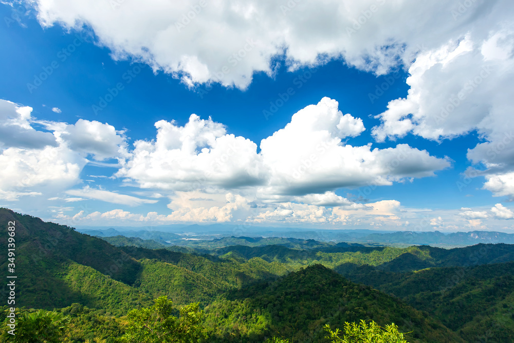 Beautiful landscape clouds in blue sky over green mountain forest nature, nature view, Save the environment.