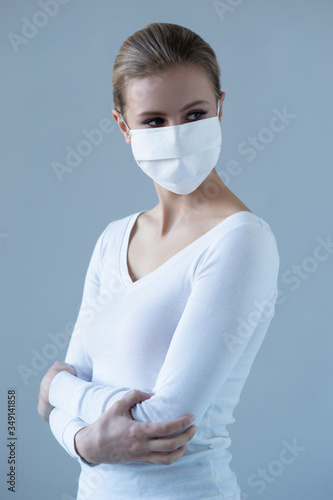 Portrait of young and natural woman in medcial mask. Pandemic, coronavirus, covid-19 and protection concept. photo