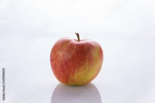 Ripe, red apples on a white background. Farm fruits