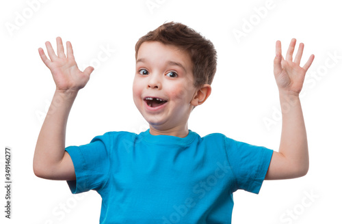 Cheerful little boy raised his hands up, isolated on white background