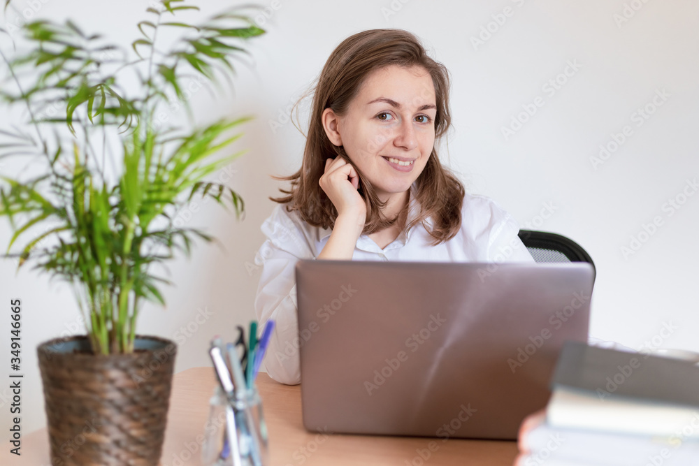 Woman working on laptop at home office while drinling coffee. Web conection Woman working on laptop at home office while drinling coffee. Web conection