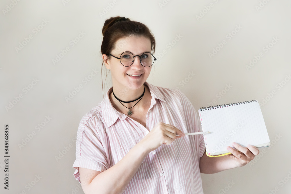 Caucasian woman in round glasses notebook, tutor Caucasian woman in round glasses notebook, tutor