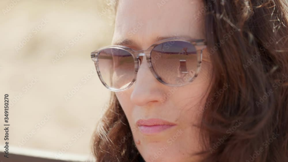 Woman on a video call in the outdoor during a social distance using a smartphone Woman on a video call in the outdoor during a social distance using a smartphone