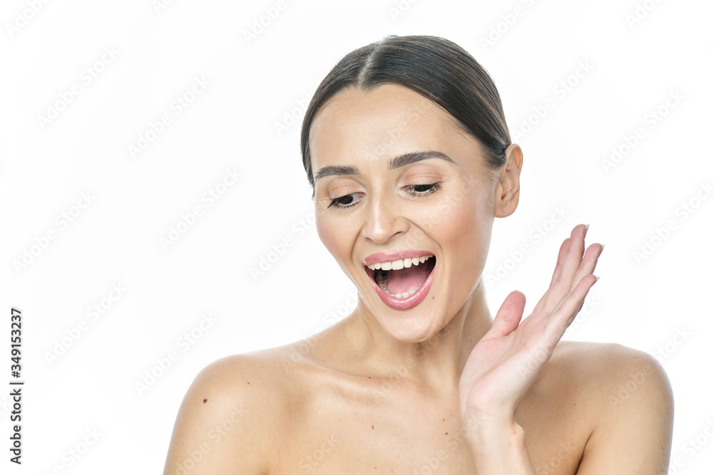 A girl with clear skin screams and looks at the camera on a white background A girl with clear skin screams and looks at the camera on a white background