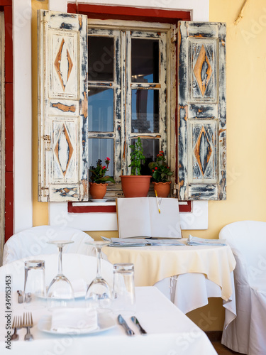 Open restaurant terrace with amazing sea view on Santorini island. Cyclades, Greece