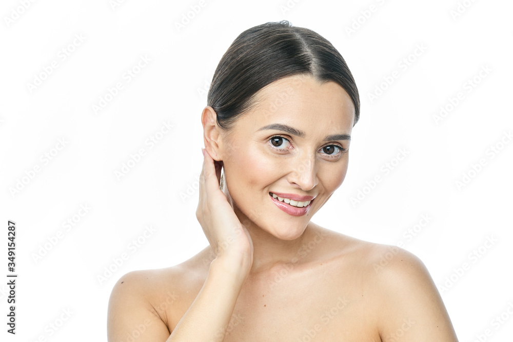 Beautiful smiling woman with clean skin, natural make-up, and white teeth on white background Beautiful smiling woman with clean skin, natural make-up, and white teeth on white background