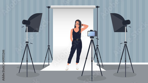 Photo Studio Vector. Girl posing to the camera. White canvas background on tripods. Camera on a tripod, softbox. Professional photo studio.