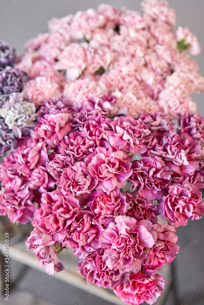 Closeup Bunches of carnation flowers different varieties in vases. Lovely Vintage background with flowers. Wallpapers. Closeup Bunches of carnation flowers different varieties in vases. Lovely Vintage background with flowers. Wallpapers.