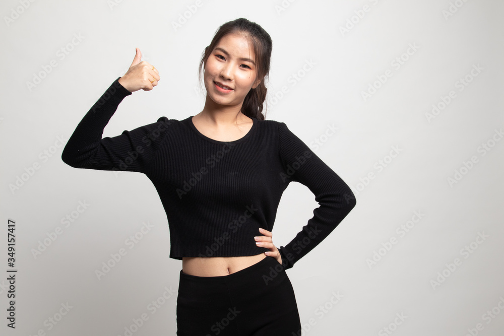 Young Asian woman show thumbs up. Young Asian woman show thumbs up.